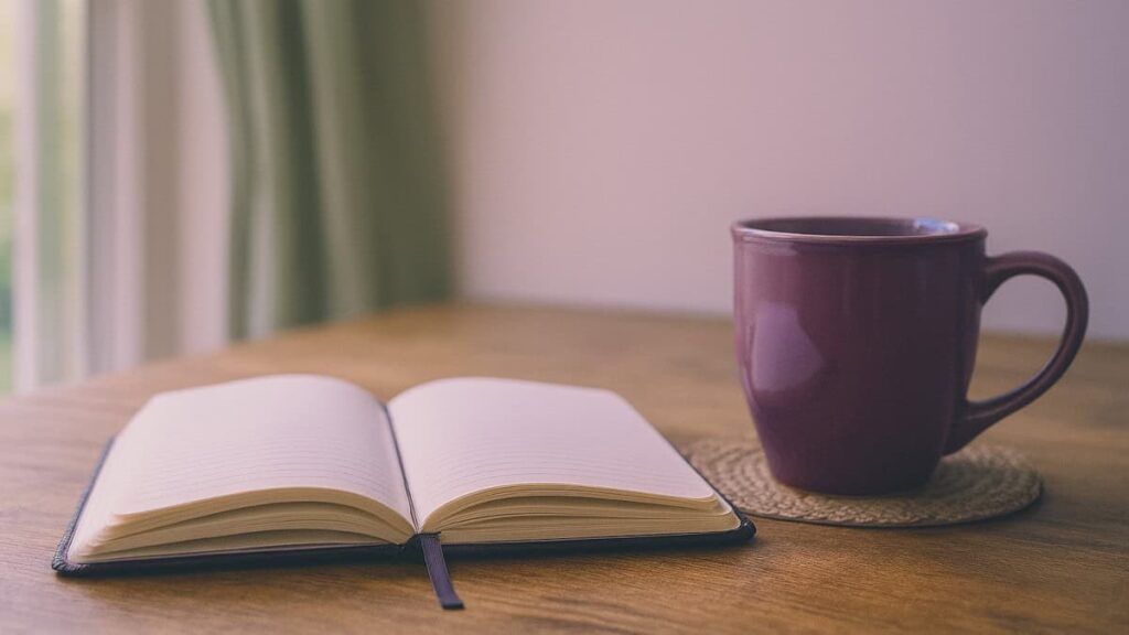 Peaceful morning scene with journal representing intentional slow living and Christian clarity