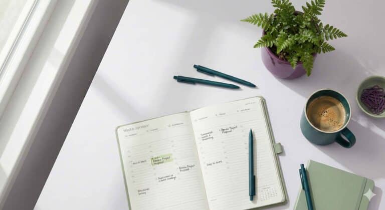 Peaceful office desk with organized planner showing 15-minute time block for workplace conflict resolution